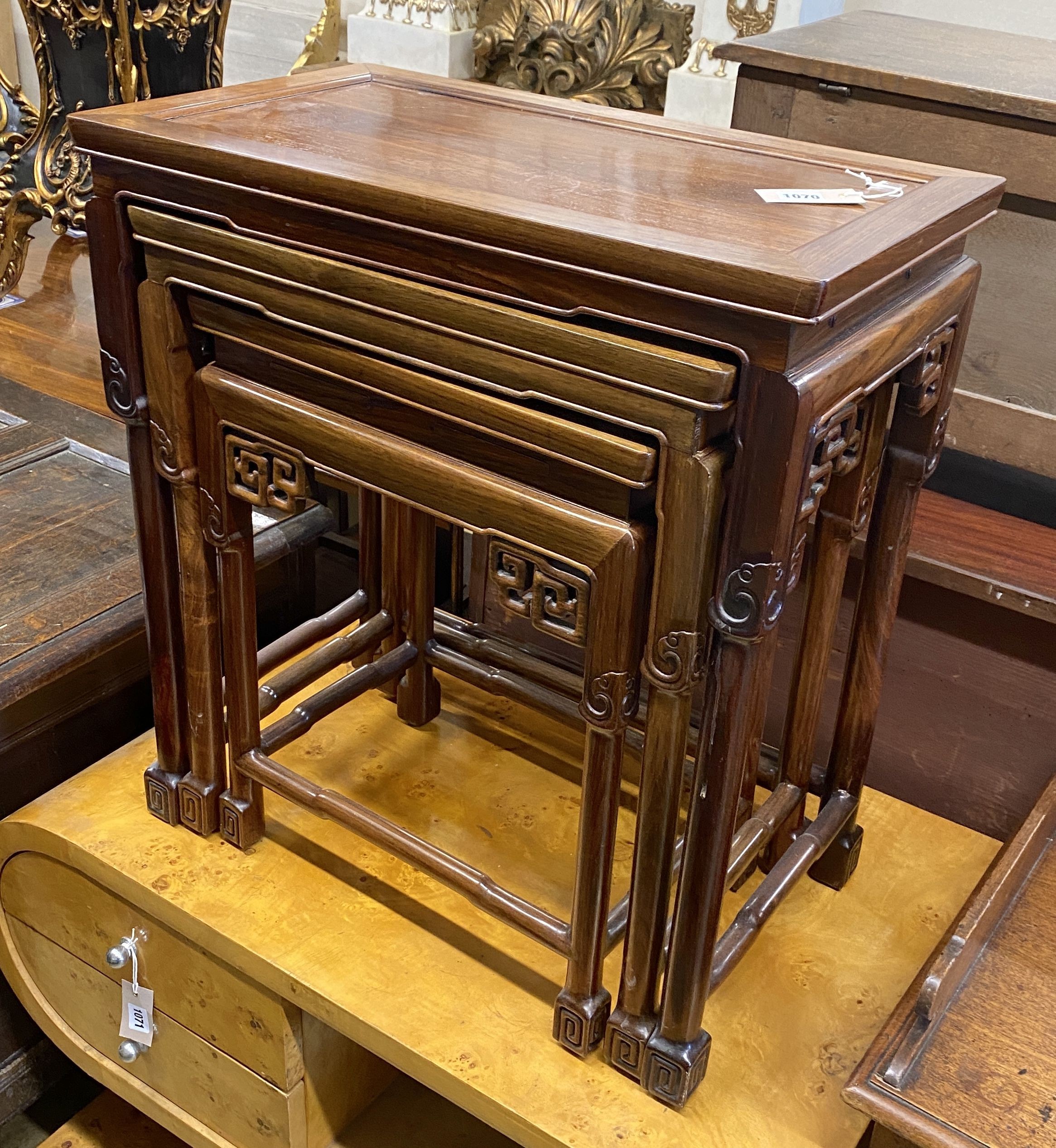 A nest of three Chinese rectangular tea tables, width 61cm, depth 36cm, height 66cm
